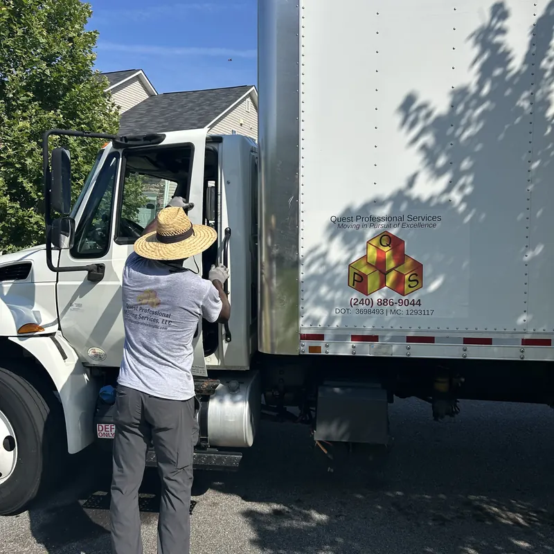 Crew member at a branded Quest box truck